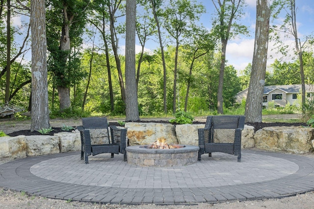 12105 285th St, Lindstrom, MN 55045 - view of patio / terrace with an outdoor fire pit
