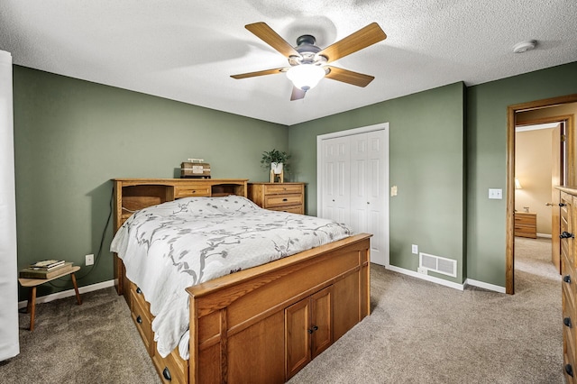 3894 Kestrel St SW, Prior Lake, MN 55372 - bedroom with dark carpet, a closet, a ceiling fan, and a textured ceiling
