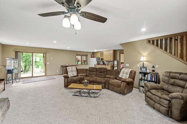 3894 Kestrel St SW, Prior Lake, MN 55372 - living area featuring light colored carpet, recessed lighting, ceiling fan, and stairway