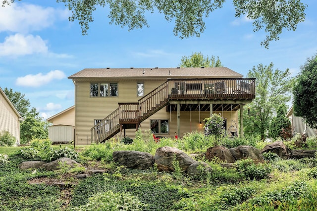 3894 Kestrel St SW, Prior Lake, MN 55372 - rear view of house with stairway and a wooden deck