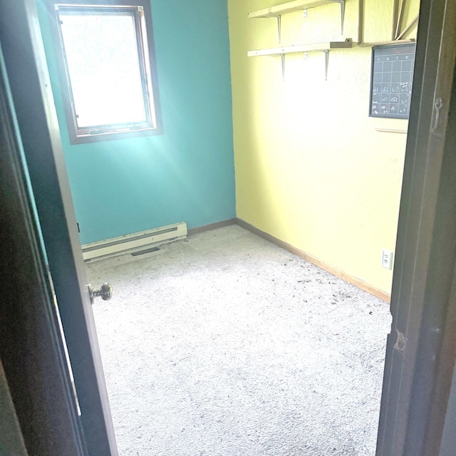 36777 280th St SE, Eden Twp, MN 56646 - carpeted spare room with a baseboard heating unit and baseboards