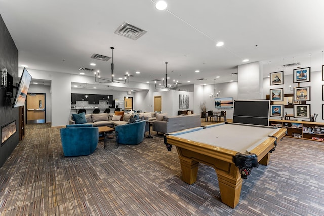 740 Portland Ave Unit 801, Minneapolis, MN 55415 - playroom with carpet floors, a glass covered fireplace, a chandelier, recessed lighting, and pool table