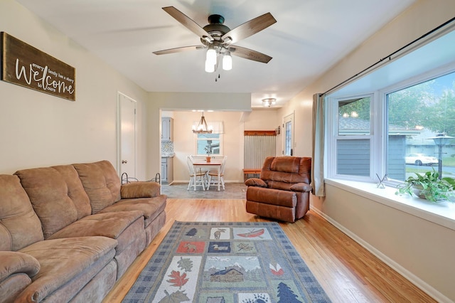16725 Anna Trl SE, Prior Lake, MN 55372 - living area featuring hardwood / wood-style flooring, a chandelier, and ceiling fan