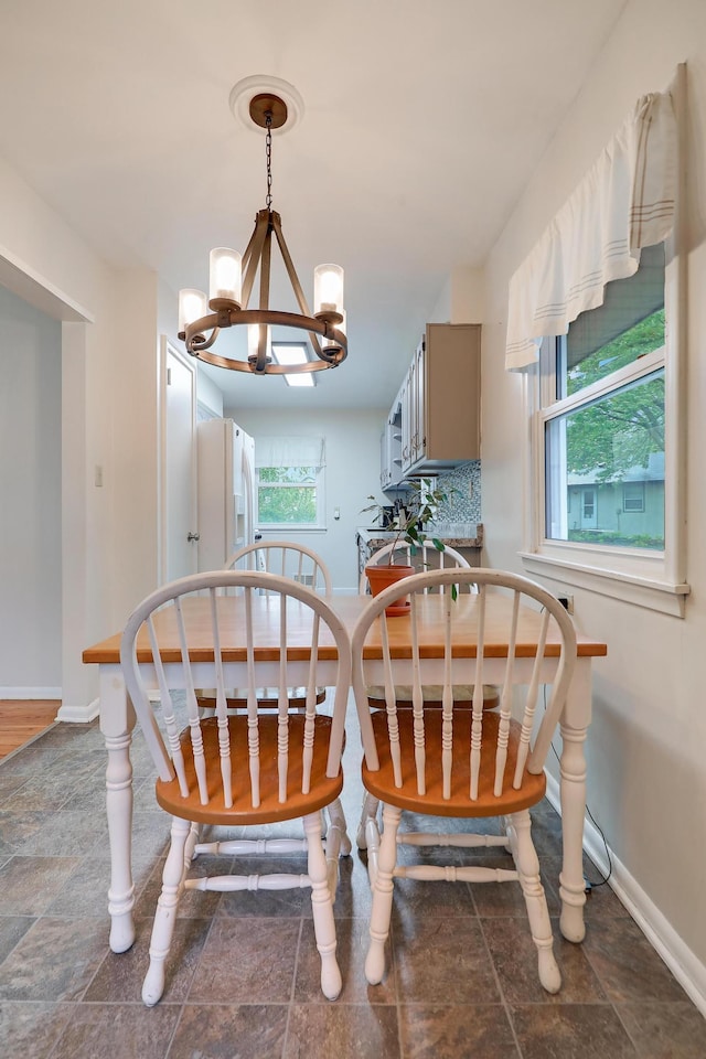 16725 Anna Trl SE, Prior Lake, MN 55372 - dining area with a chandelier and stone finish flooring