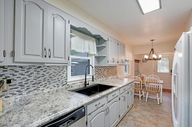 16725 Anna Trl SE, Prior Lake, MN 55372 - kitchen featuring freestanding refrigerator, open shelves, a chandelier, dishwashing machine, and backsplash