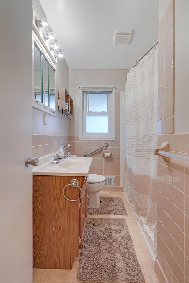 16725 Anna Trl SE, Prior Lake, MN 55372 - bathroom with tile walls, tile patterned flooring, vanity, a shower with curtain, and wainscoting