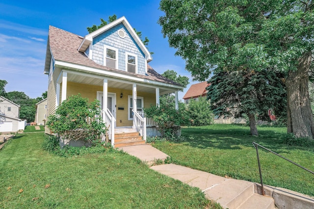 2931 Lyndale Ave N, Minneapolis, MN 55411 - bungalow-style house featuring covered porch, a front lawn, and a shingled roof