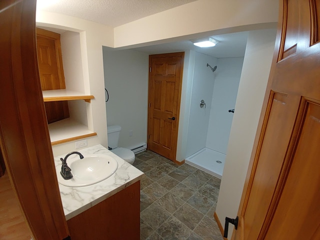 1959 79th St, Georgetown Twp, WI 54853 - full bathroom with a shower stall, a baseboard heating unit, vanity, and a textured ceiling