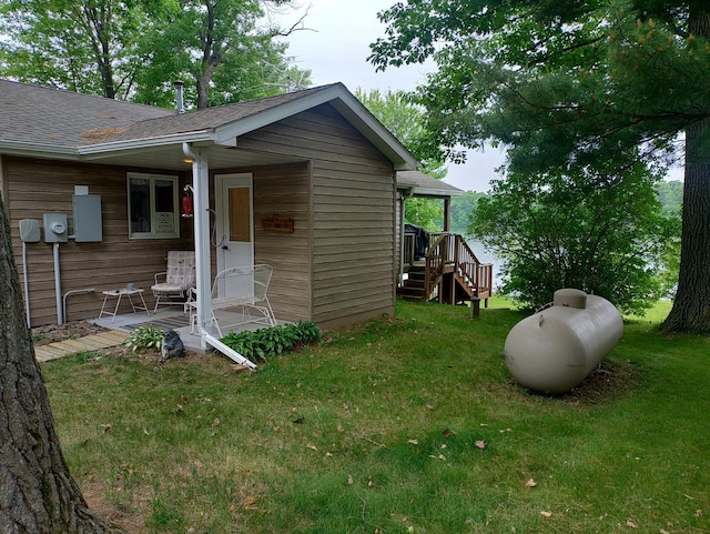 1959 79th St, Georgetown Twp, WI 54853 - exterior space featuring a yard, roof with shingles, and stairway