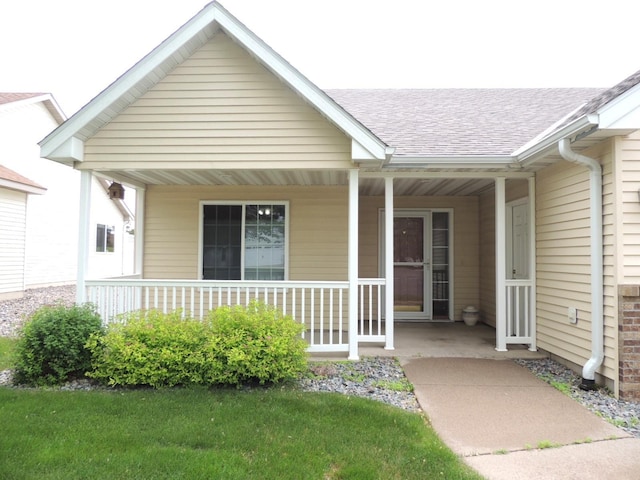 38 Glenview Loop, Saint Cloud, MN 56303 - view of exterior entry with covered porch and a shingled roof