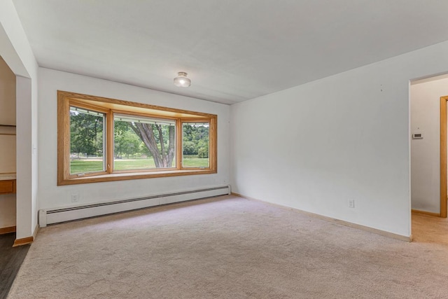 713 Sherman St, North Mankato, MN 56003 - unfurnished room with a baseboard radiator and carpet