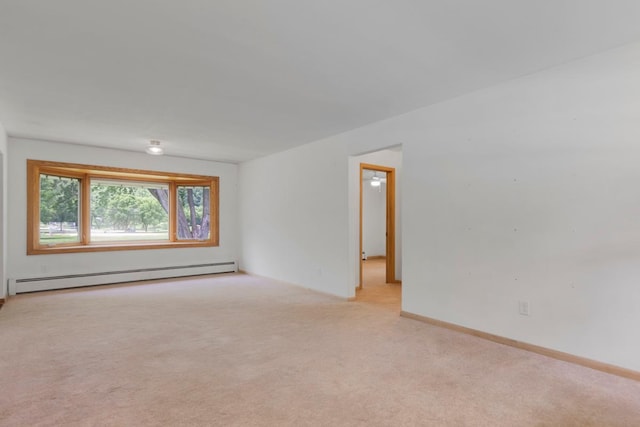 713 Sherman St, North Mankato, MN 56003 - unfurnished room featuring a baseboard radiator and light carpet