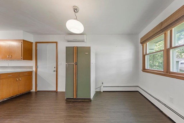 713 Sherman St, North Mankato, MN 56003 - unfurnished dining area featuring a wall mounted AC, baseboard heating, and dark wood-style floors