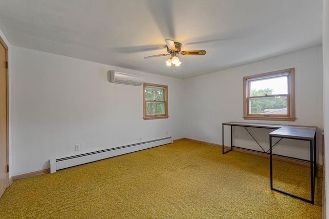 713 Sherman St, North Mankato, MN 56003 - spare room featuring a baseboard heating unit, an AC wall unit, plenty of natural light, and a ceiling fan