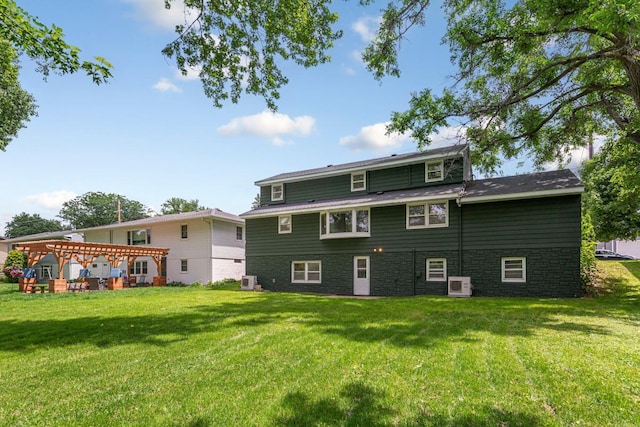 713 Sherman St, North Mankato, MN 56003 - back of property with a lawn and a pergola
