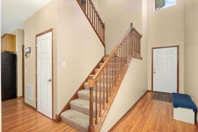 1816 Commonwealth Blvd, Chanhassen, MN 55317 - stairs with wood finished floors and a high ceiling