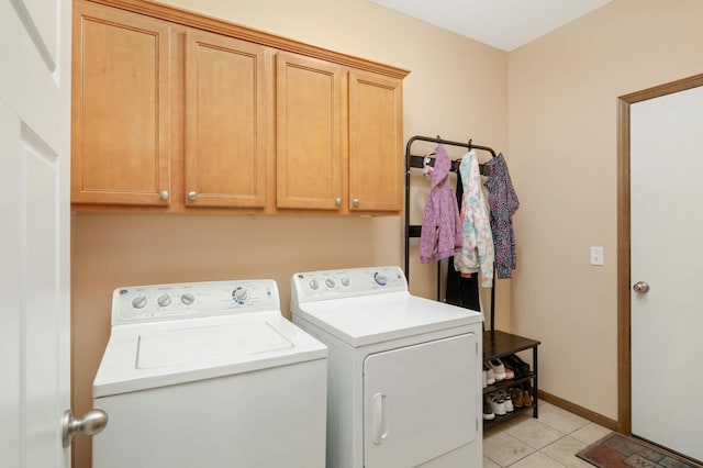 1816 Commonwealth Blvd, Chanhassen, MN 55317 - laundry room with washer and clothes dryer, cabinet space, and light tile patterned floors