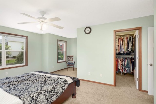 1816 Commonwealth Blvd, Chanhassen, MN 55317 - bedroom featuring light carpet, a walk in closet, a closet, and a ceiling fan