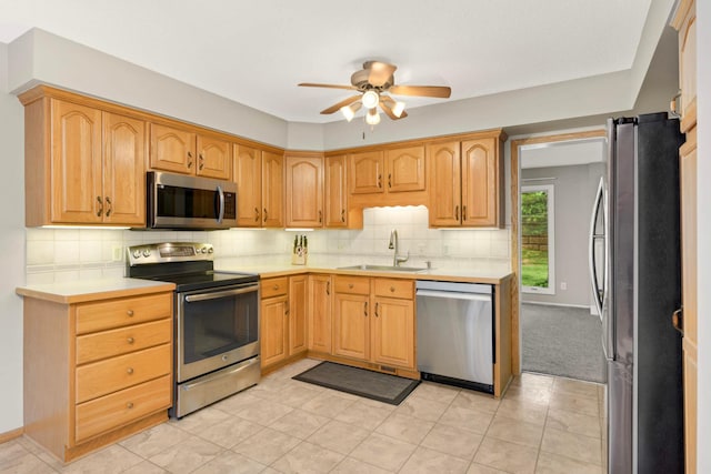 11140 Abbott Ln, Minnetonka, MN 55343 - kitchen with appliances with stainless steel finishes, a ceiling fan, light countertops, and decorative backsplash