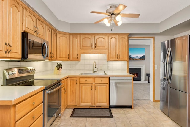 11140 Abbott Ln, Minnetonka, MN 55343 - kitchen featuring stainless steel appliances, ceiling fan, decorative backsplash, and light countertops