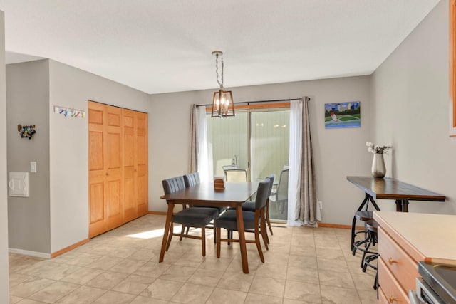11140 Abbott Ln, Minnetonka, MN 55343 - dining area with a chandelier and baseboards