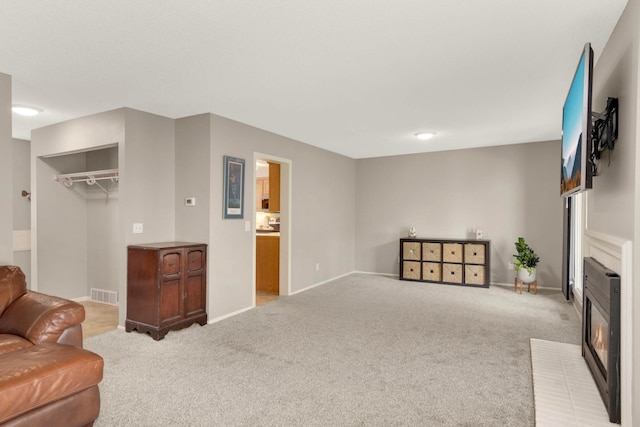 11140 Abbott Ln, Minnetonka, MN 55343 - living room with light colored carpet and a glass covered fireplace