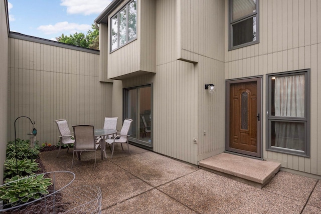 11140 Abbott Ln, Minnetonka, MN 55343 - doorway to property featuring a patio area and outdoor dining space