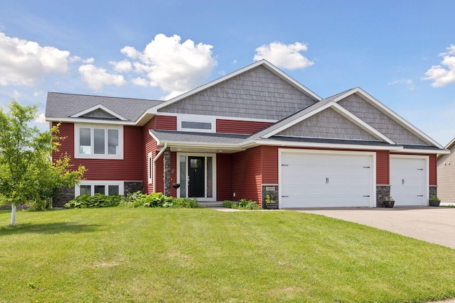 1664 Otter Way, New Richmond, WI 54017 - craftsman-style house with an attached garage, driveway, a front yard, stone siding, and a shingled roof