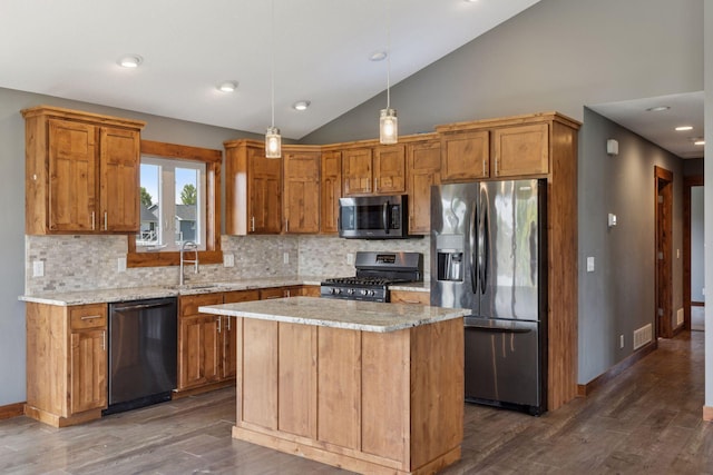 1664 Otter Way, New Richmond, WI 54017 - kitchen with stainless steel appliances, lofted ceiling, dark wood finished floors, backsplash, and decorative light fixtures