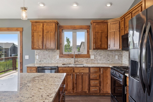 1664 Otter Way, New Richmond, WI 54017 - kitchen with fridge with ice dispenser, gas stove, black microwave, dark wood-style flooring, and dishwasher