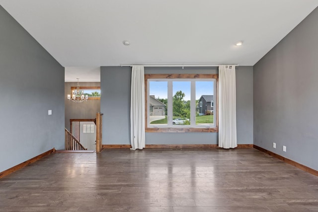 1664 Otter Way, New Richmond, WI 54017 - spare room with a chandelier, wood finished floors, and recessed lighting
