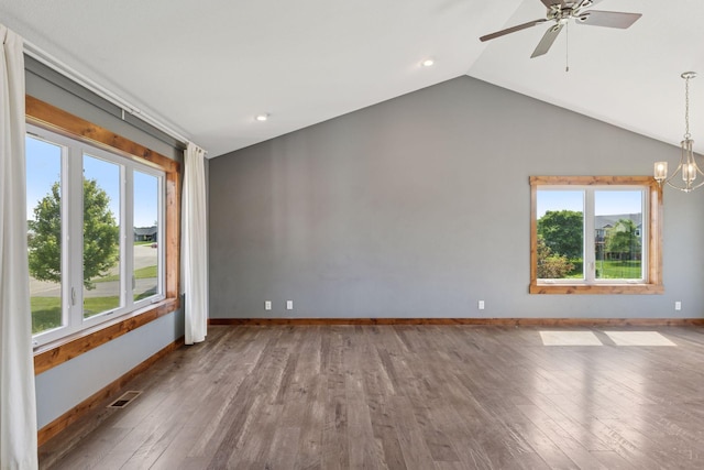 1664 Otter Way, New Richmond, WI 54017 - empty room with healthy amount of natural light, ceiling fan, hardwood / wood-style floors, vaulted ceiling, and recessed lighting