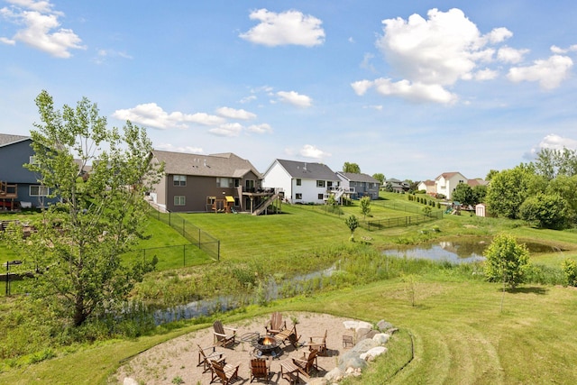 1664 Otter Way, New Richmond, WI 54017 - view of yard featuring an outdoor fire pit, a residential view, and a water view