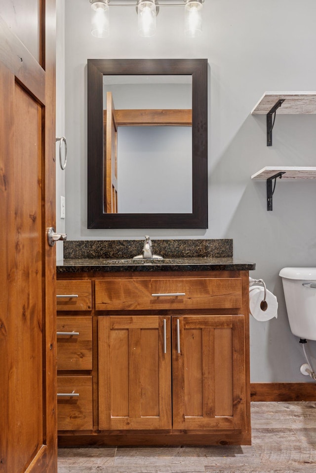 1664 Otter Way, New Richmond, WI 54017 - half bathroom featuring vanity and wood finished floors