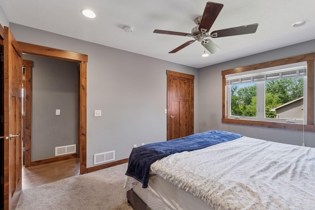 1664 Otter Way, New Richmond, WI 54017 - carpeted bedroom featuring recessed lighting, a closet, and a ceiling fan