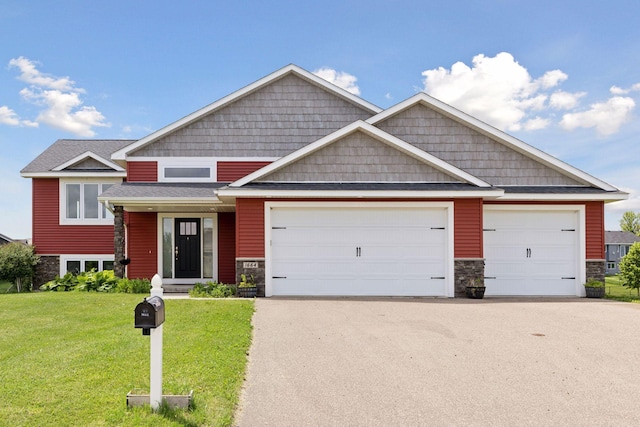 1664 Otter Way, New Richmond, WI 54017 - craftsman inspired home with stone siding, a front lawn, a garage, and driveway