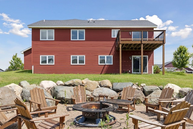 1664 Otter Way, New Richmond, WI 54017 - back of house featuring an outdoor fire pit, a lawn, and a balcony