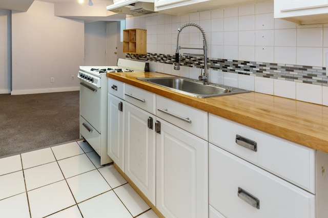 4720 Nicollet Ave Unit 5, Minneapolis, MN 55419 - kitchen featuring white range with gas cooktop, wood counters, extractor fan, light colored carpet, and backsplash