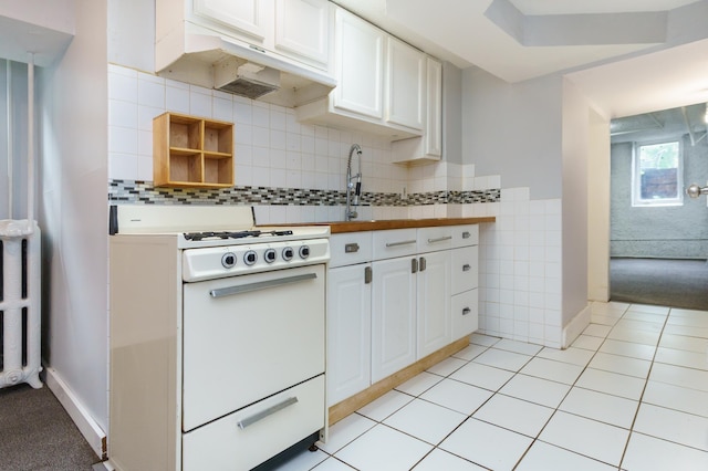 4720 Nicollet Ave Unit 5, Minneapolis, MN 55419 - kitchen with white range with gas stovetop, under cabinet range hood, white cabinets, butcher block counters, and decorative backsplash