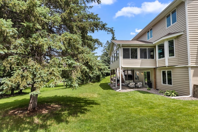 1541 Wexford Ct, Eagan, MN 55122 - view of green lawn featuring a sunroom and a patio