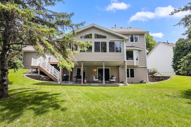 1541 Wexford Ct, Eagan, MN 55122 - rear view of house featuring a patio area, a lawn, a wooden deck, and stairway