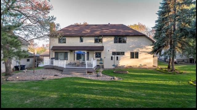 469 Lake Wabasso Ct, Shoreview, MN 55126 - rear view of property featuring a deck, a lawn, and a chimney