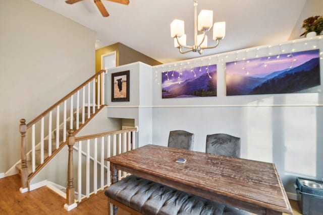 7467 Meadowwood Ct, Brooklyn Park, MN 55444 - dining area with wood finished floors, a chandelier, and ceiling fan