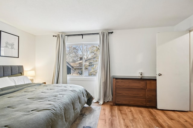 7467 Meadowwood Ct, Brooklyn Park, MN 55444 - bedroom with light wood-type flooring