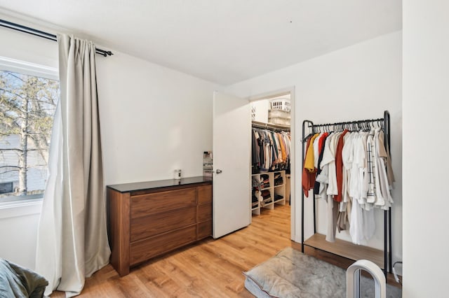 7467 Meadowwood Ct, Brooklyn Park, MN 55444 - walk in closet featuring light wood-style floors