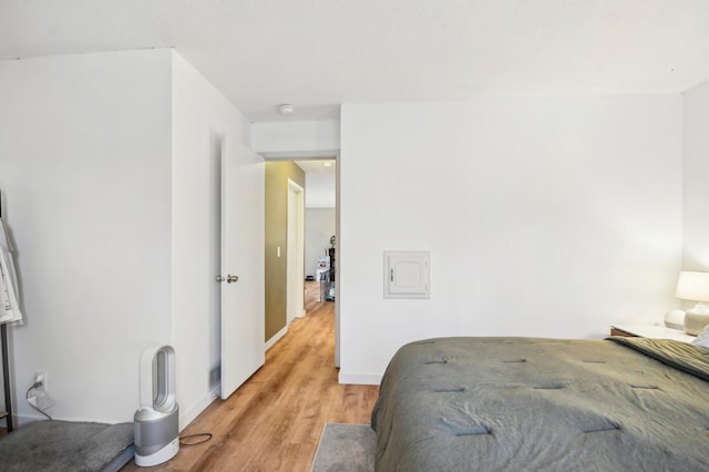 7467 Meadowwood Ct, Brooklyn Park, MN 55444 - bedroom with light wood-style floors and baseboards