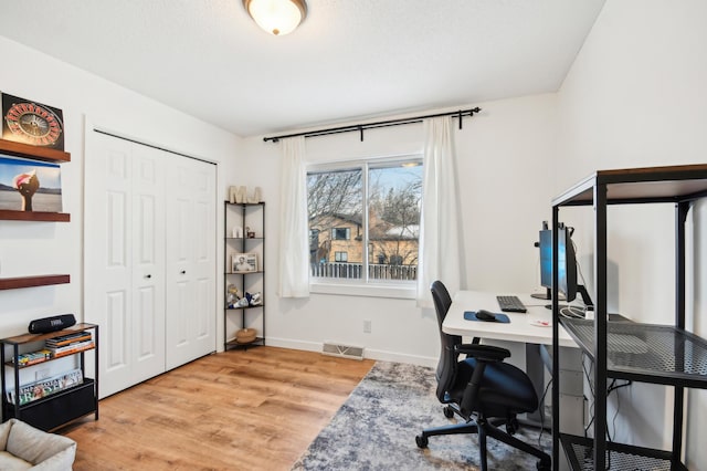 7467 Meadowwood Ct, Brooklyn Park, MN 55444 - office space featuring light wood-type flooring and baseboards