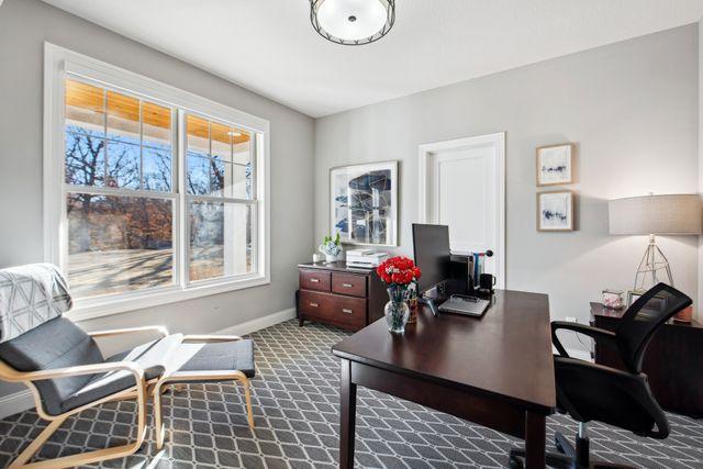 19803 Jersey Ave, Lakeville, MN 55044 - home office with dark carpet and baseboards