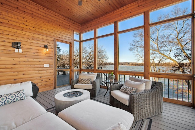 19803 Jersey Ave, Lakeville, MN 55044 - sunroom with an outdoor living space with a fire pit and a water view