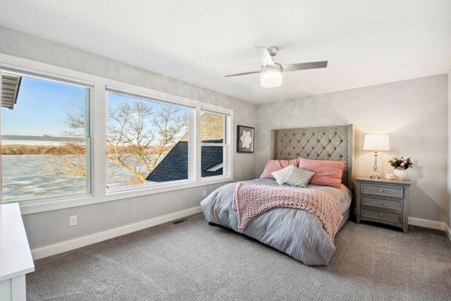 19803 Jersey Ave, Lakeville, MN 55044 - bedroom with carpet and a ceiling fan